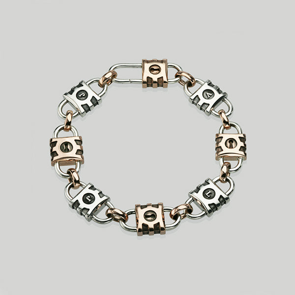 A bespoke men's bracelet with padlocks in rose gold and sterling silver.